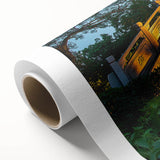 Rolled canvas showcasing a vibrant landscape bridge design, featuring rich colors and intricate details, packaged securely in a protective cardboard tube for easy transport.