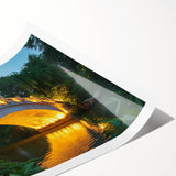 Rolled print of a scenic landscape bridge design, showcasing vibrant colors and intricate details, securely packaged in a sturdy cardboard tube for protection.