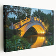 Stretched canvas print showcasing a serene landscape bridge scene, featuring vibrant greens and blues, perfect for adding tranquility to home decor.
