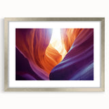 A silver-framed landscape print showcasing vibrant canyons, elegantly matted for added depth, perfect for enhancing home decor with natural beauty.