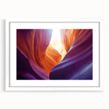 Framed landscape artwork depicting vibrant canyons in earthy tones, showcasing a white mat and sleek frame, ideal for enhancing modern home decor.