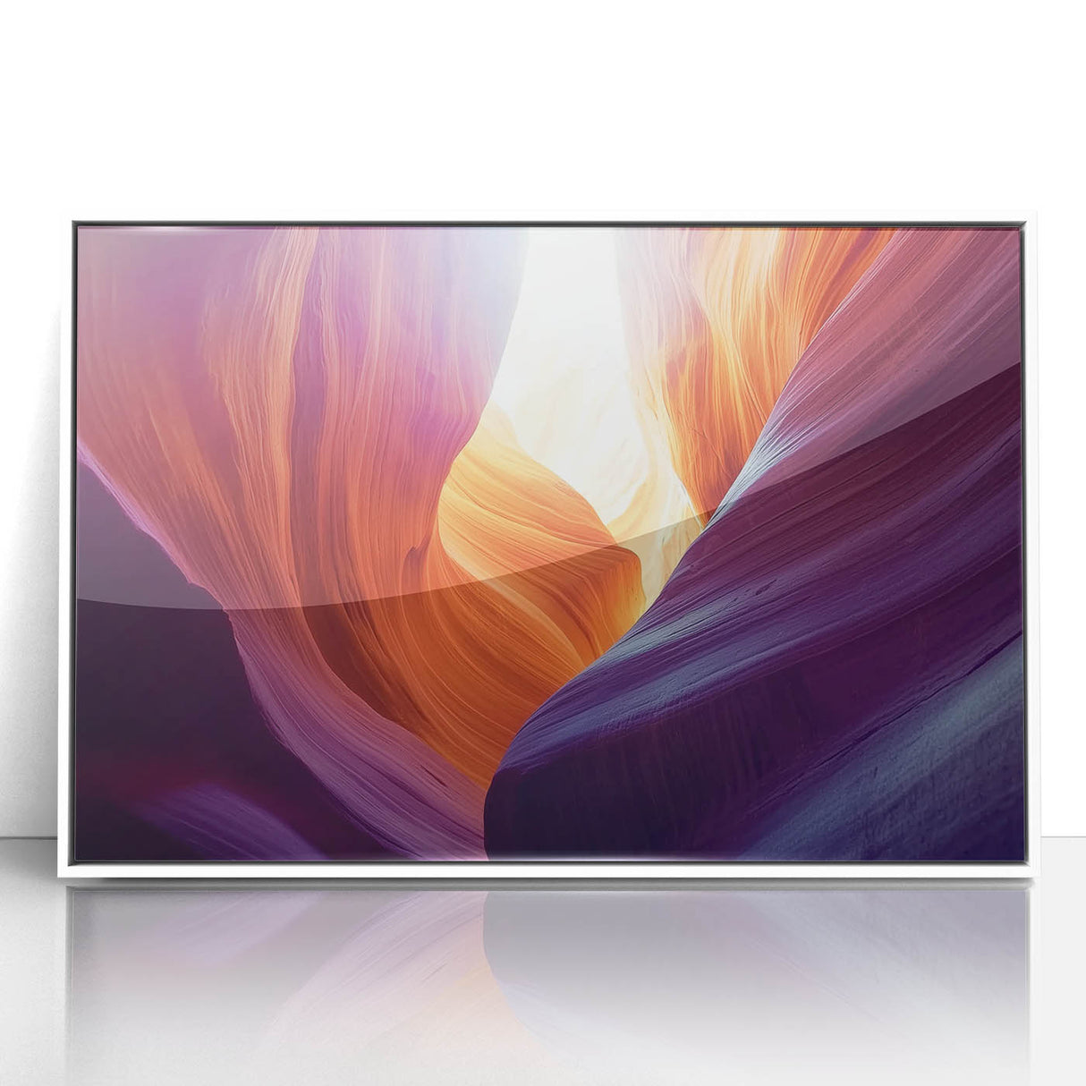 Framed acrylic wall art depicting a stunning landscape of colorful canyons, featuring vibrant hues of orange and red against a white frame, perfect for home decor.