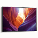 Framed canvas artwork showcasing a stunning landscape of canyons in rich earthy tones, set against a sleek black frame, ideal for modern home decor.