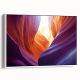 Framed canvas artwork showcasing a stunning landscape of canyons with vibrant colors, set against a white frame, ideal for enhancing home decor and art collections.