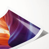 Stunning landscape print depicting vibrant canyons with rich reds and oranges, rolled for easy shipping in a protective cardboard tube, perfect for home decor.