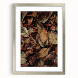 Textured abstract art print featuring autumnal hues on a silver-framed mat, ideal for bedroom art.