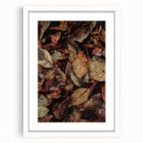 Abstract art print featuring swirling autumnal hues on a white framed canvas, suitable for dining room or bedroom decor.