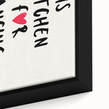 Close-up of textured black wall art featuring colorful, inspirational food-themed phrases on a framed canvas.