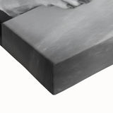 Large art of a black and white landscape painting on stretched canvas, featuring shadowed figures in a field.