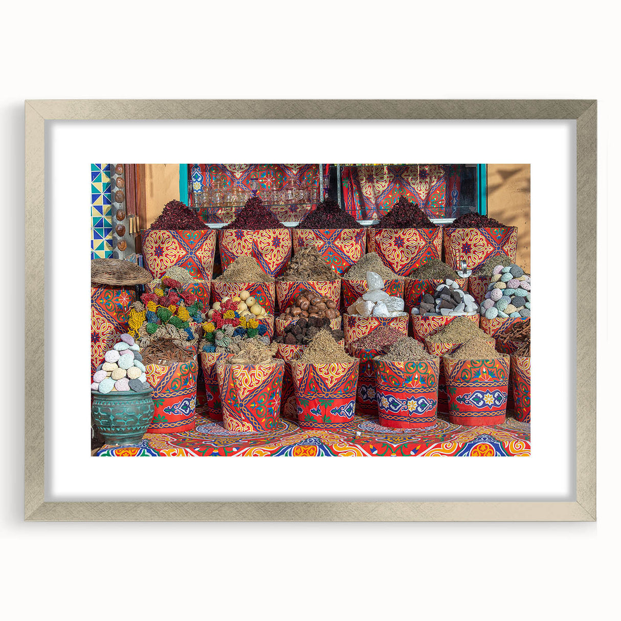 Abstract art print of an Egyptian landscape in muted earth tones, framed in silver, suitable for dining room decor.