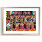 Abstract art print of an Egyptian landscape in muted earth tones, framed in silver, suitable for dining room decor.