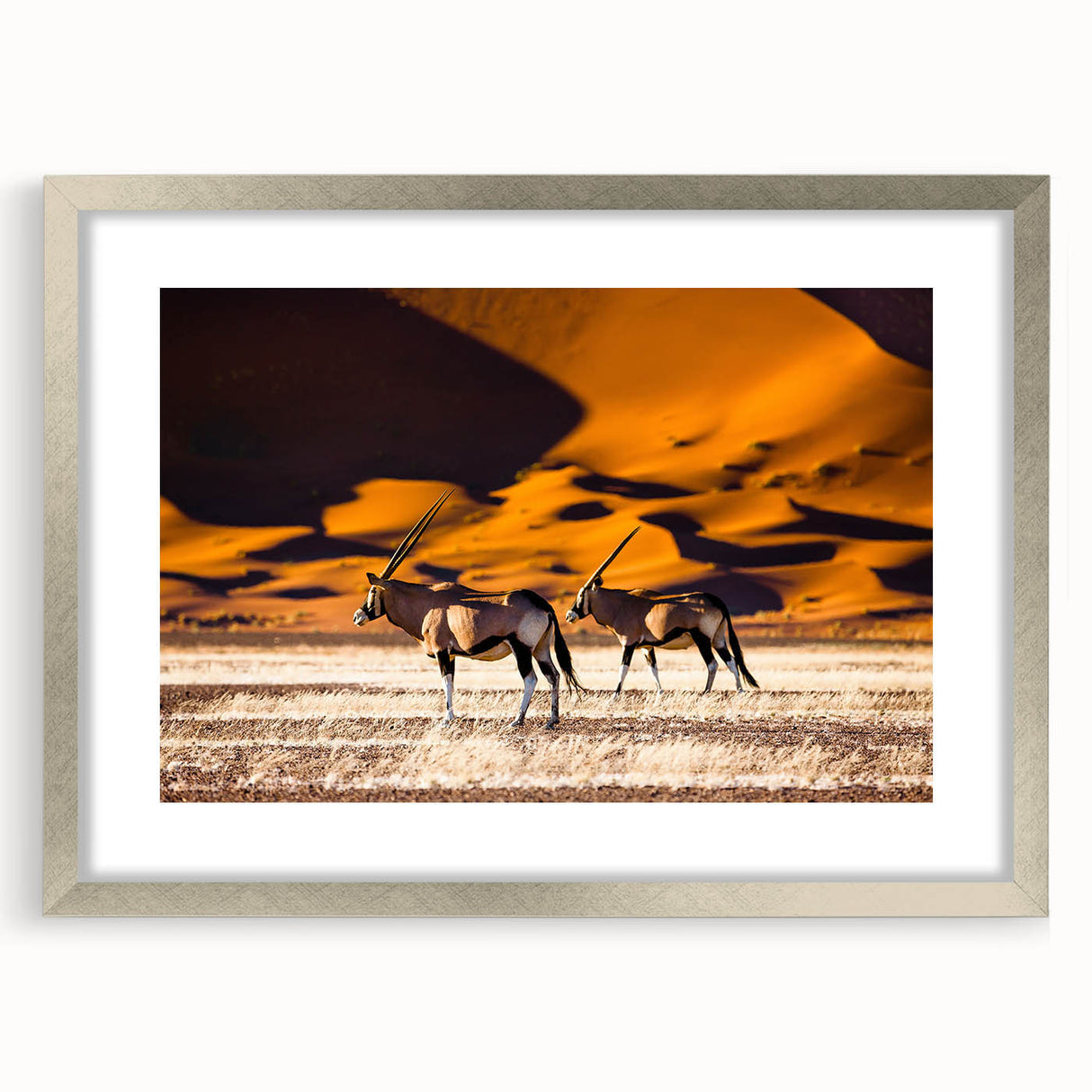 Abstract art print of Namibian landscape in silver frame, featuring earthy tones, ideal for dining room decor.