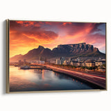 Framed canvas landscape painting of an African savannah at sunset, with muted gold and black tones.