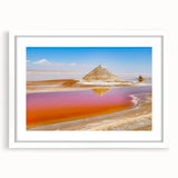 Abstract art print depicting a Tunisian landscape in muted earth tones on a framed white mat, suitable for dining room decor.