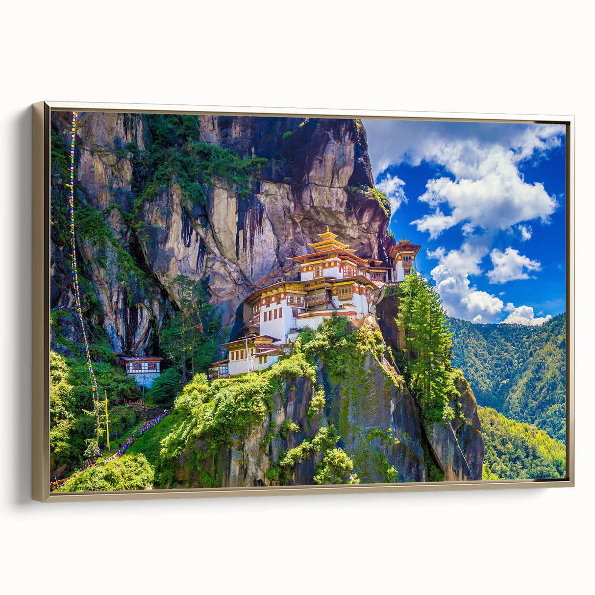 Framed canvas featuring a vintage-style landscape painting of Bhutan in muted gold and black tones.