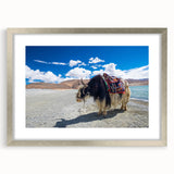 Textured art depicting abstract Tibetan scenery in muted earth tones on a silver-framed mat, suited for bedroom wall decor.