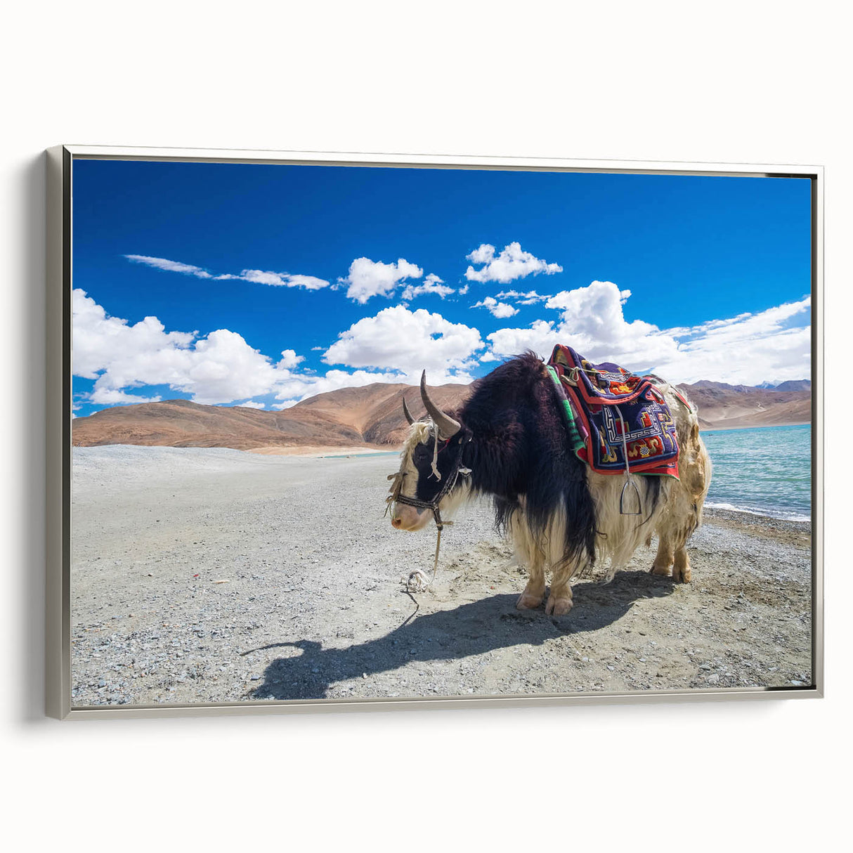 Framed canvas landscape art painting depicting Tibet scenery in vibrant colors on a black background.
