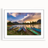 Abstract art print depicting a serene Laos scenery in muted green and blue tones on a white framed canvas.