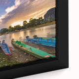 Framed canvas featuring a textured, colorful depiction of a Laos scenery in black with vibrant accents.