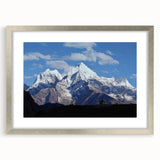Textured art print depicting abstract mountain scenery in muted earth tones, framed in silver, ideal for bedroom decor.