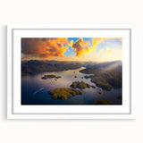 Abstract art print of British Columbia scenery in muted green and blue tones on a white framed canvas.