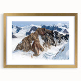 Extra large abstract art print of the Yukon scenery, featuring textured brush strokes in earth tones, framed in gold.