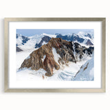 Textured art of abstract Yukon scenery in muted earth tones, framed in silver, ideal for bedroom art.