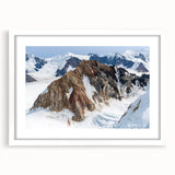 Abstract art print of Yukon scenery in muted earth tones on a framed white mat, ideal for dining room decor.