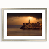 Extra large abstract art print of Caribbean scenery in muted blue and green tones, framed in silver.