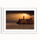 Textured abstract art print of a Caribbean scene in muted blue and green, framed in white, ideal for bedroom art.