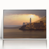 Mid-century modernist art depicting a Caribbean scenery in muted blue and green, acrylic print framed in white.