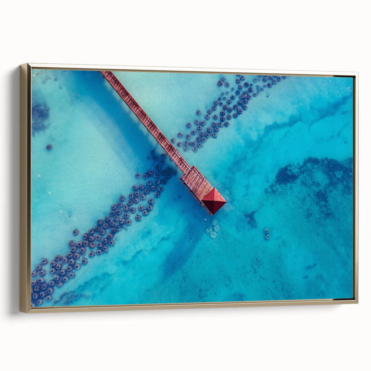 Landscape painting of a Caribbean scene with palm trees on a framed canvas, in muted earth tones.