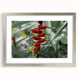 Extra large abstract art print depicting a Caribbean scenery in textured hues of blue and green, framed in silver.