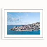 Textured abstract art print of a European scenery in muted earth tones on a framed white mat, ideal for bedroom art.