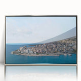 Mid-century modernist art depicting a serene Albanian landscape on a silver-framed acrylic.