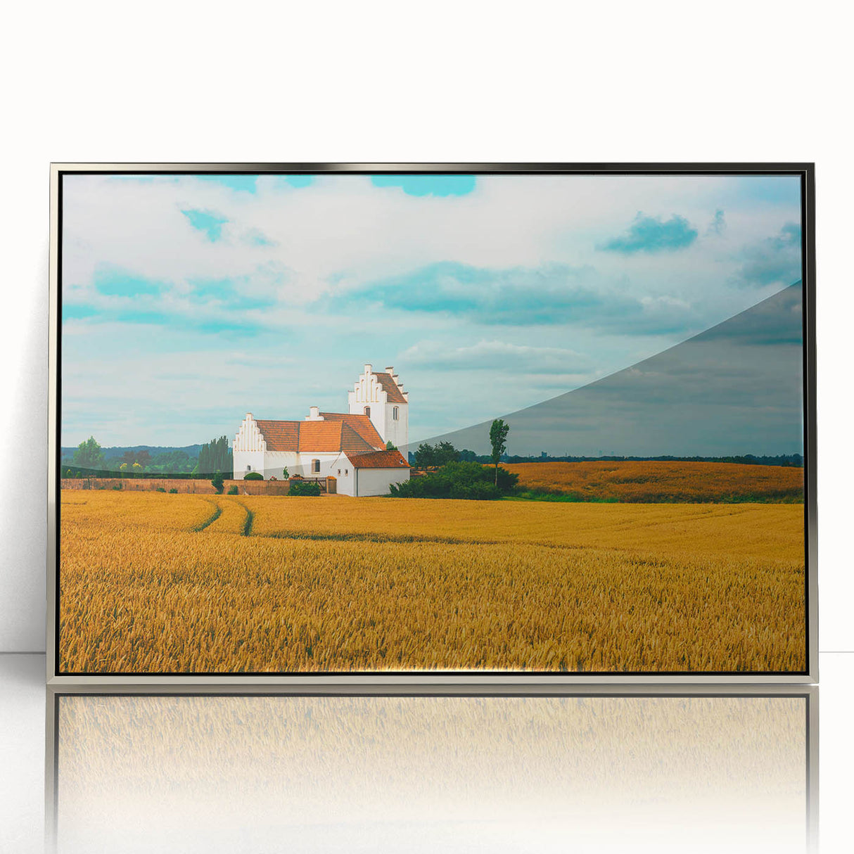 Large art print of a serene Danish landscape in muted greens and blues on a framed acrylic.