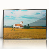 Large art print of a serene Danish landscape in muted greens and blues on a framed acrylic.