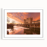 Textured art depicting an abstract European cityscape in muted gray and blue tones, framed with a white mat.