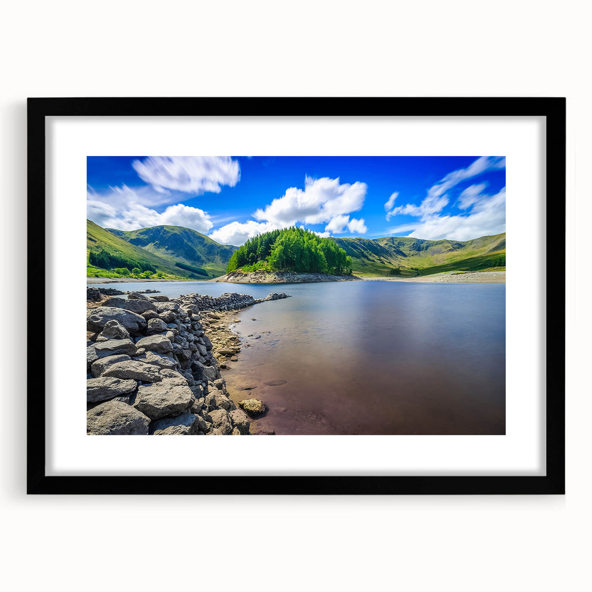 Extra large abstract art print featuring colorful textured scenery of Cumbria, England in a black frame.