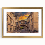 Abstract art print of Oxford scenery in muted earth tones, framed in gold, ideal for dining room decor.