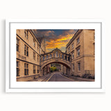 Textured abstract art print of Oxford scenery in muted earth tones, framed with a white mat, suitable for bedroom decor.