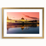 Abstract art print of Lyon scenery in muted earth tones, framed with a gold mat, suitable for dining room decor.