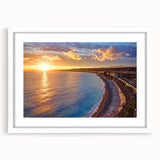 Textured abstract art print of a European seaside in muted blue and white tones, framed with a white mat.