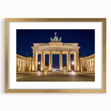Extra large abstract art print of Berlin scenery in gold frame, featuring textured designs in muted earth tones.