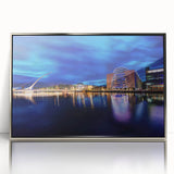 Large art print of a serene Irish landscape in muted green and blue tones, framed in silver acrylic.