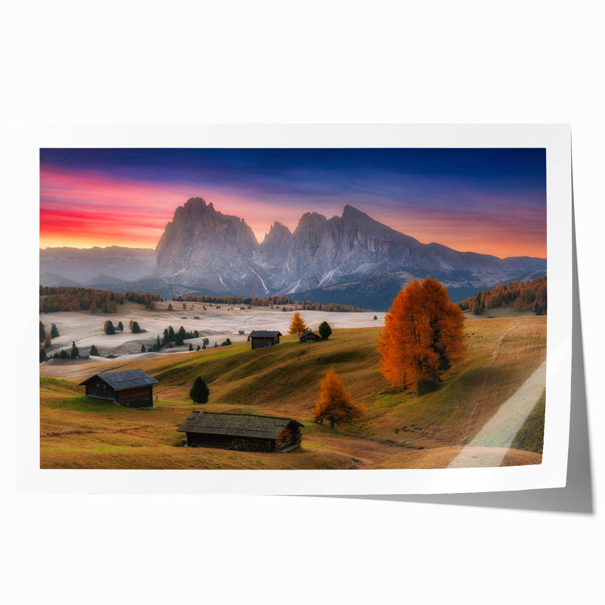 Rolled print of the Dolomites in Italy featuring lush green landscapes and distant mountains, ideal for dining room wall art.