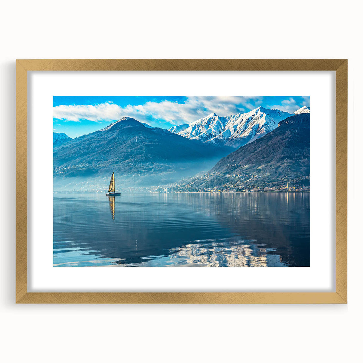 Abstract art print of Lake Como with muted blue and green hues on a framed gold mat, ideal for dining room decor.