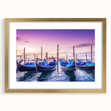 Abstract art print of Venice scenery in muted gold and blue tones on a framed mat, ideal for dining room decor.