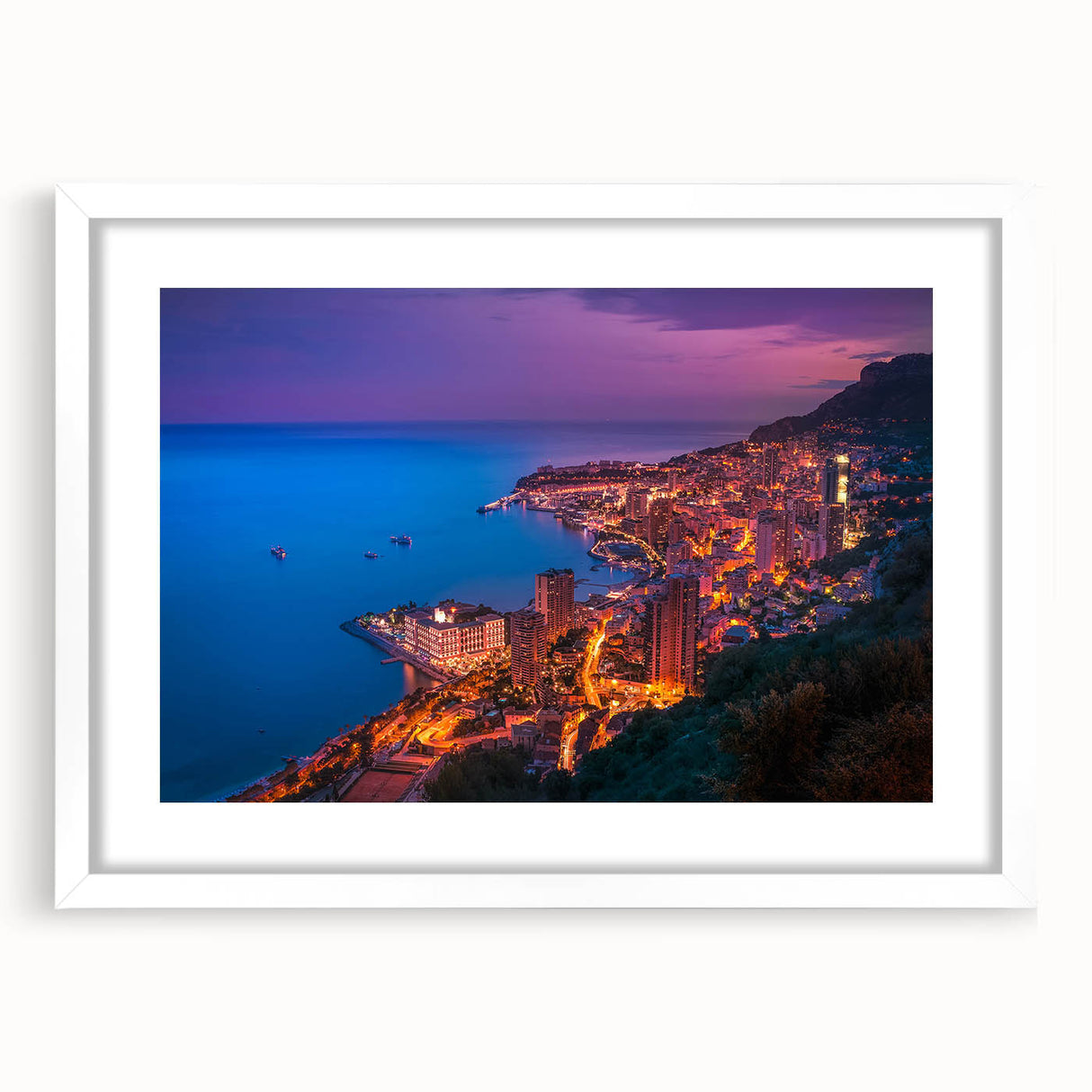 Textured abstract art print depicting a scenic Monaco view in muted blue and white tones, framed with a white mat.