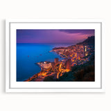Textured abstract art print depicting a scenic Monaco view in muted blue and white tones, framed with a white mat.